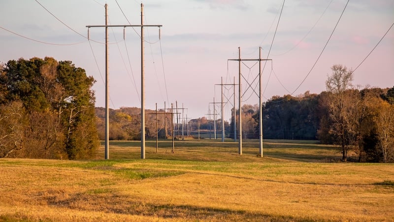 Old electric power lines stretch to the horizon over farmland and
trees